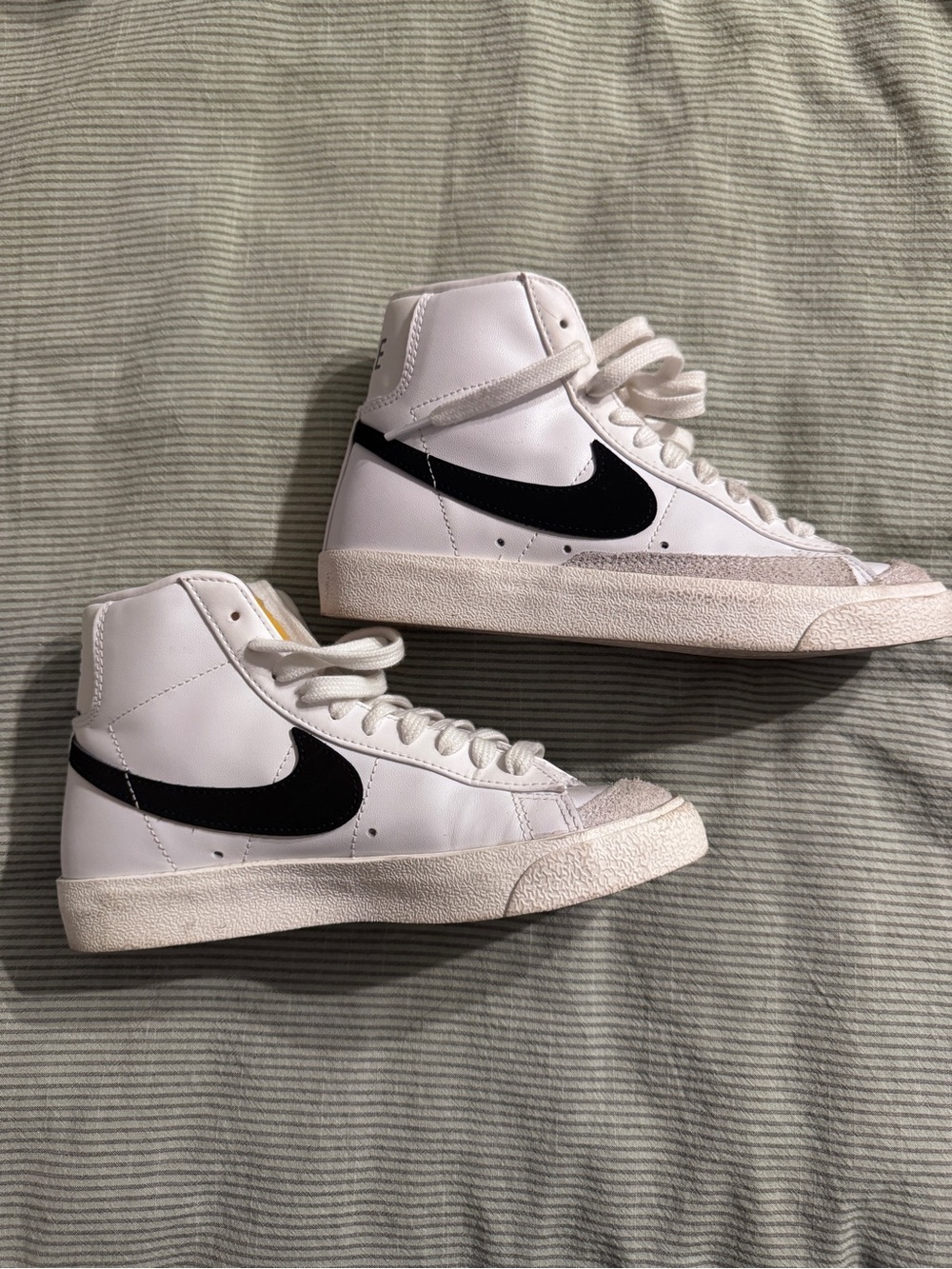 Nike White High-Top Sneakers with Black Swoosh